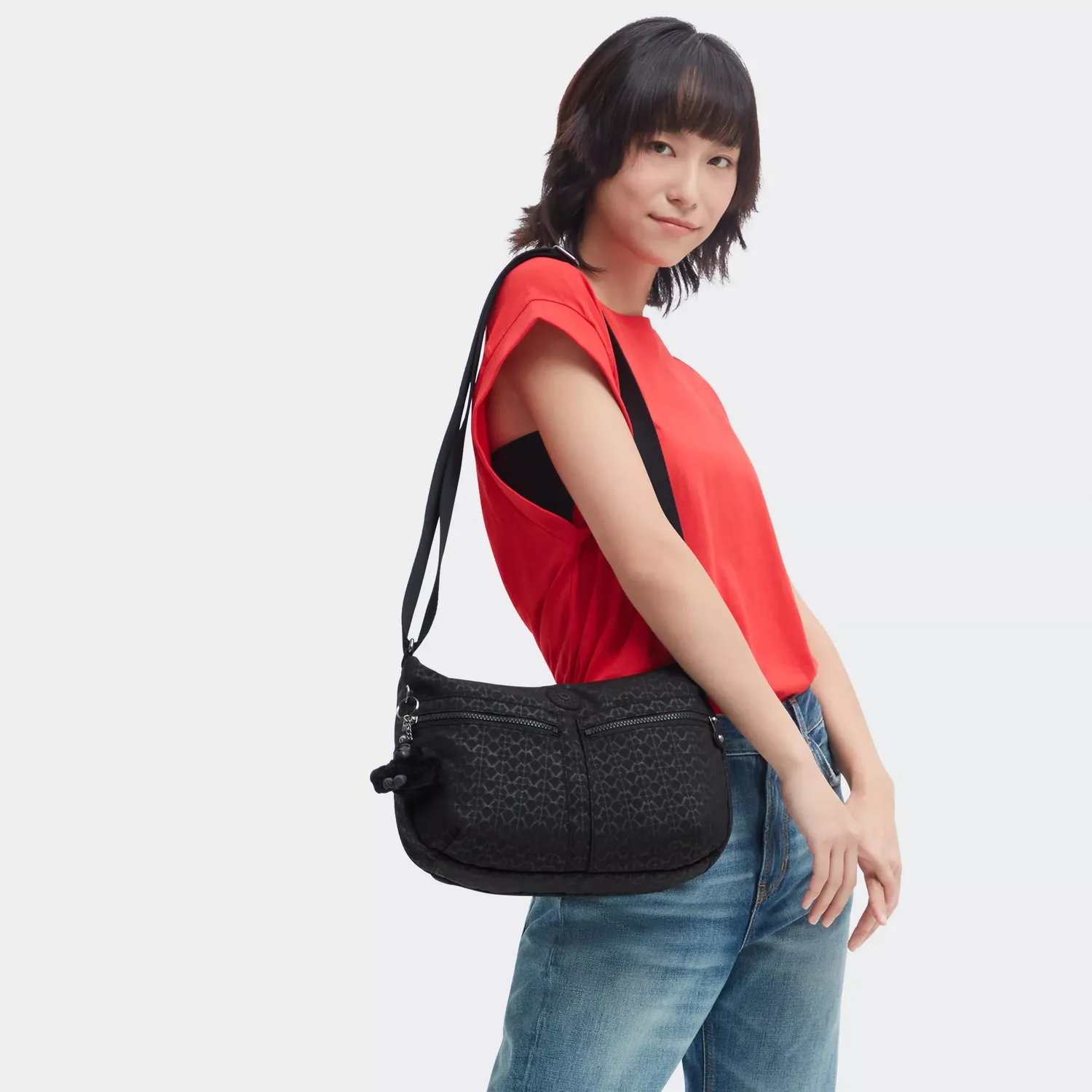 Kipling Izellah schoudertas Signature Emb Medium waterafstotend