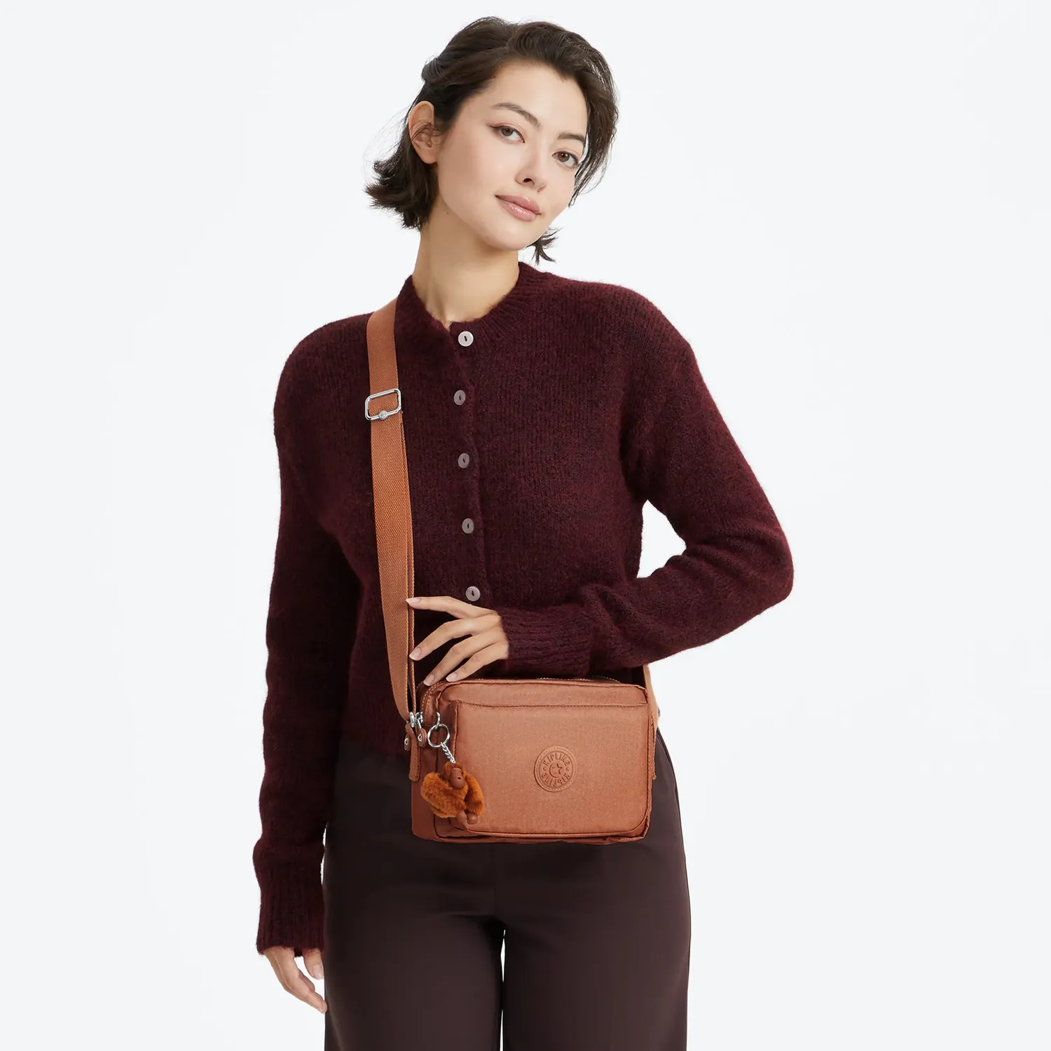 Kipling Abanu M crossbody tas Medium Copper Glimmer glans