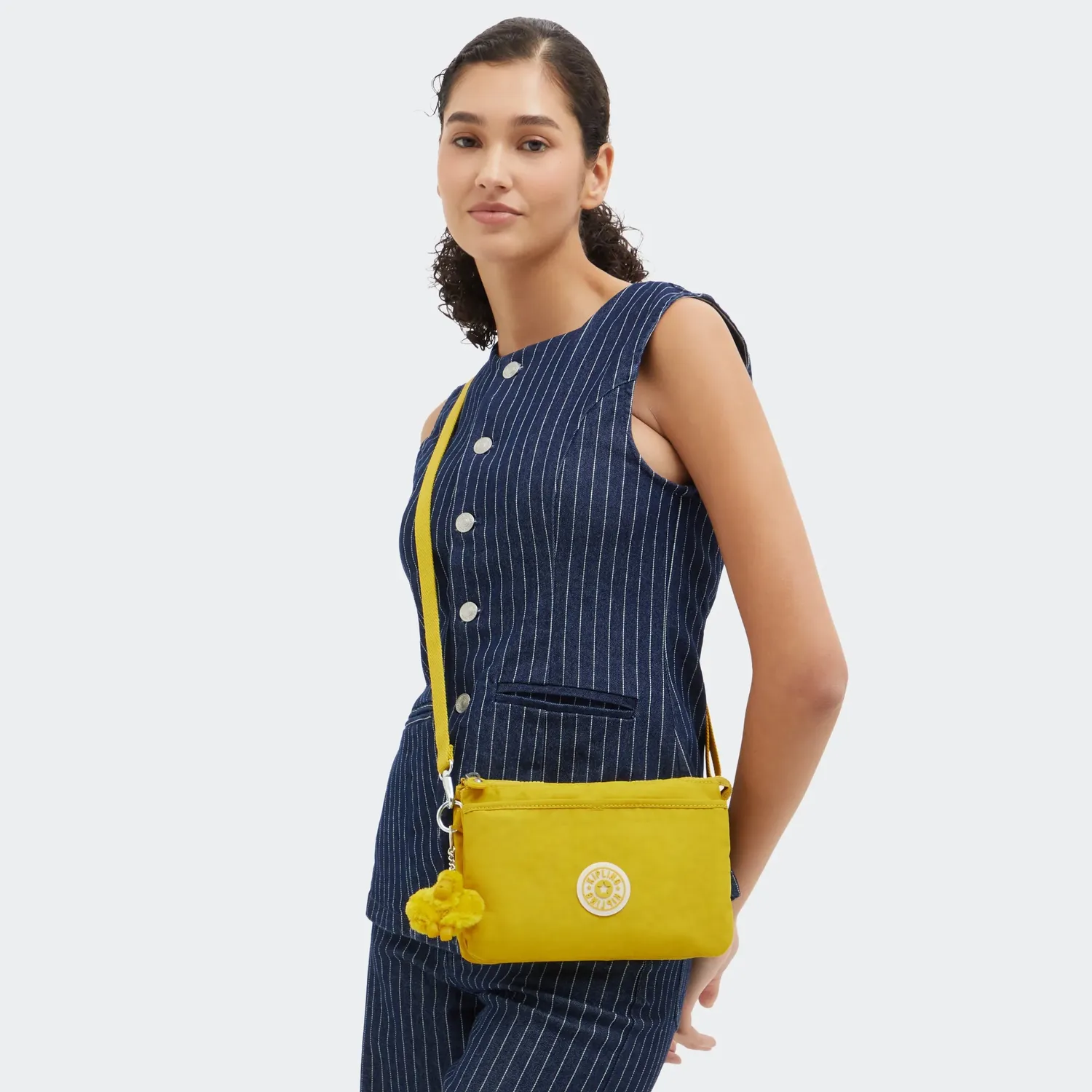 Kipling Riri crossbodytas klein Inside Yellow waterafstotend