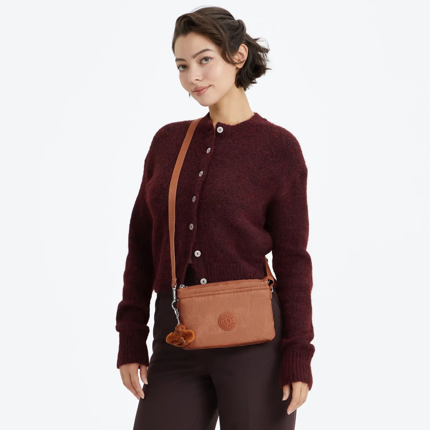 Kipling Riri crossbodytas Klein Copper Glimmer metallic