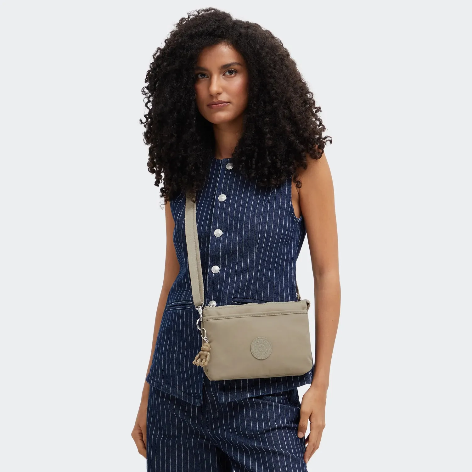 Kipling Riri crossbodytas Klein Boho Tan waterafstotend