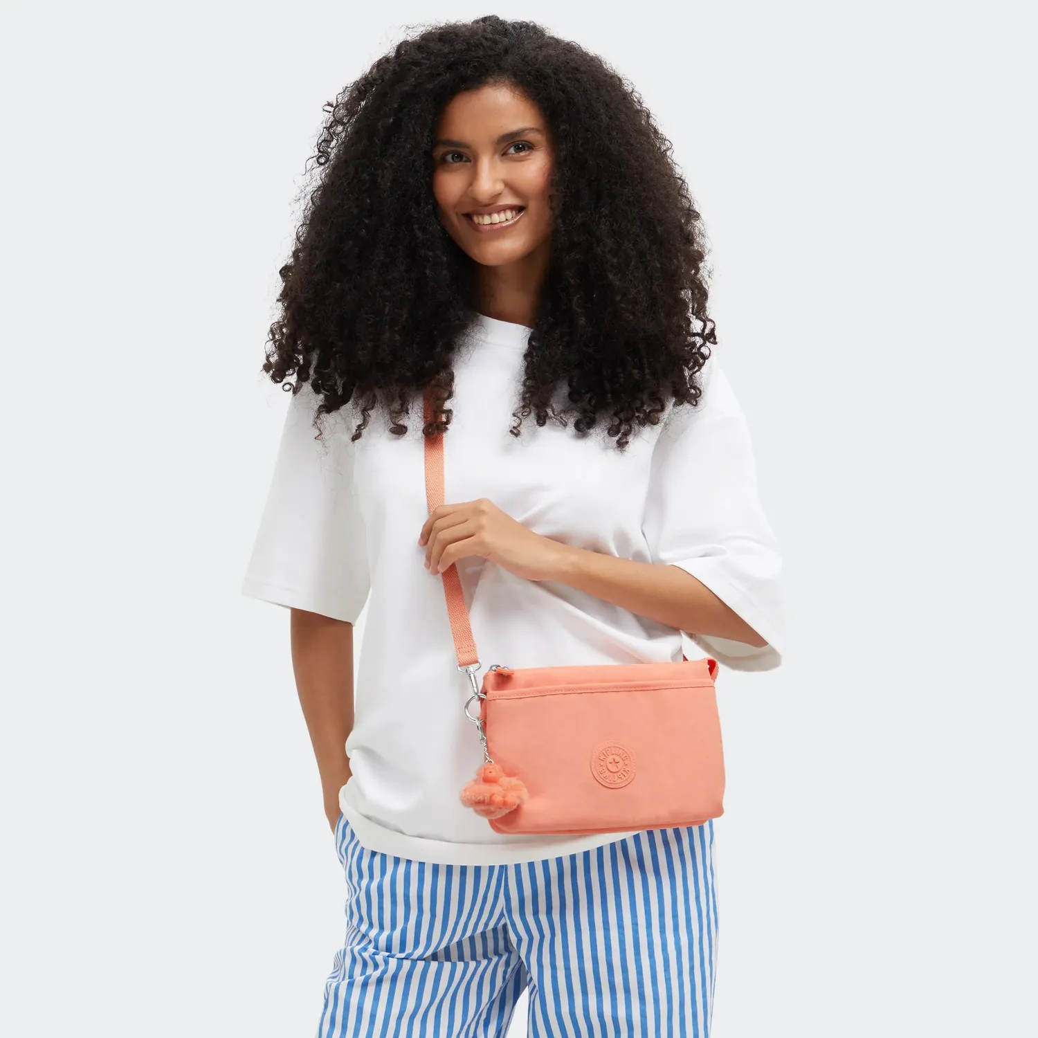 Kipling Riri crossbody klein Pinky Orange waterafstotend