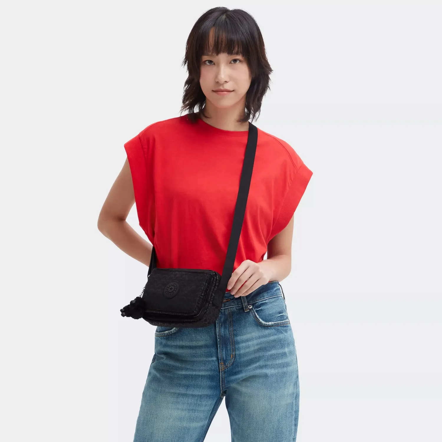 Kipling Abanu crossbody tas klein Signature Emb bedrukt