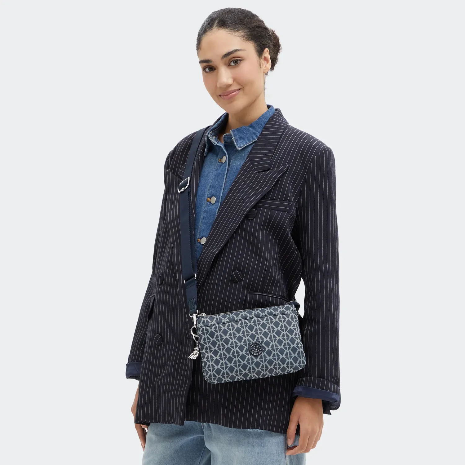 Kipling Riri crossbodytas klein Navy Sign Jacquard ritsvakken