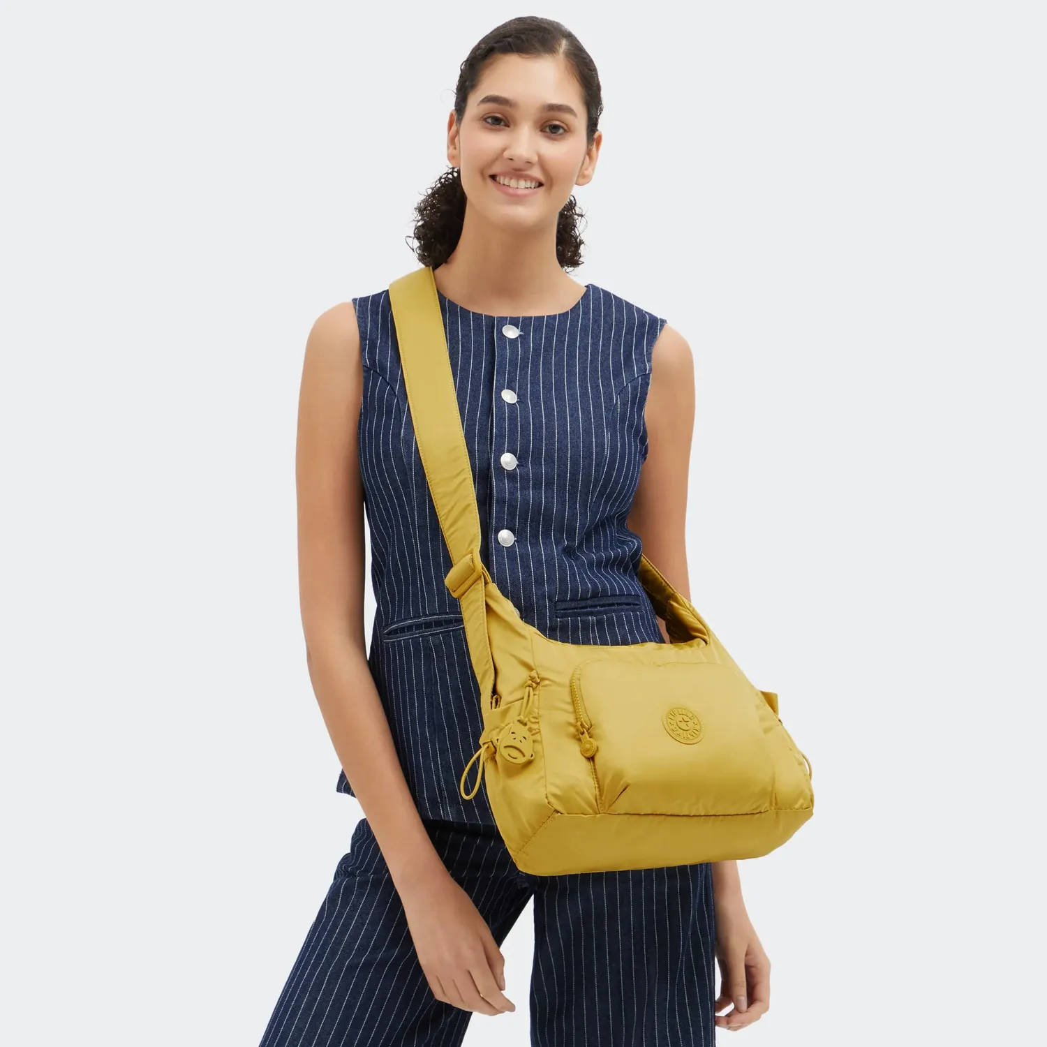 Kipling Gabb S crossbodytas Daisy Yellow medium met trekkoordvakken