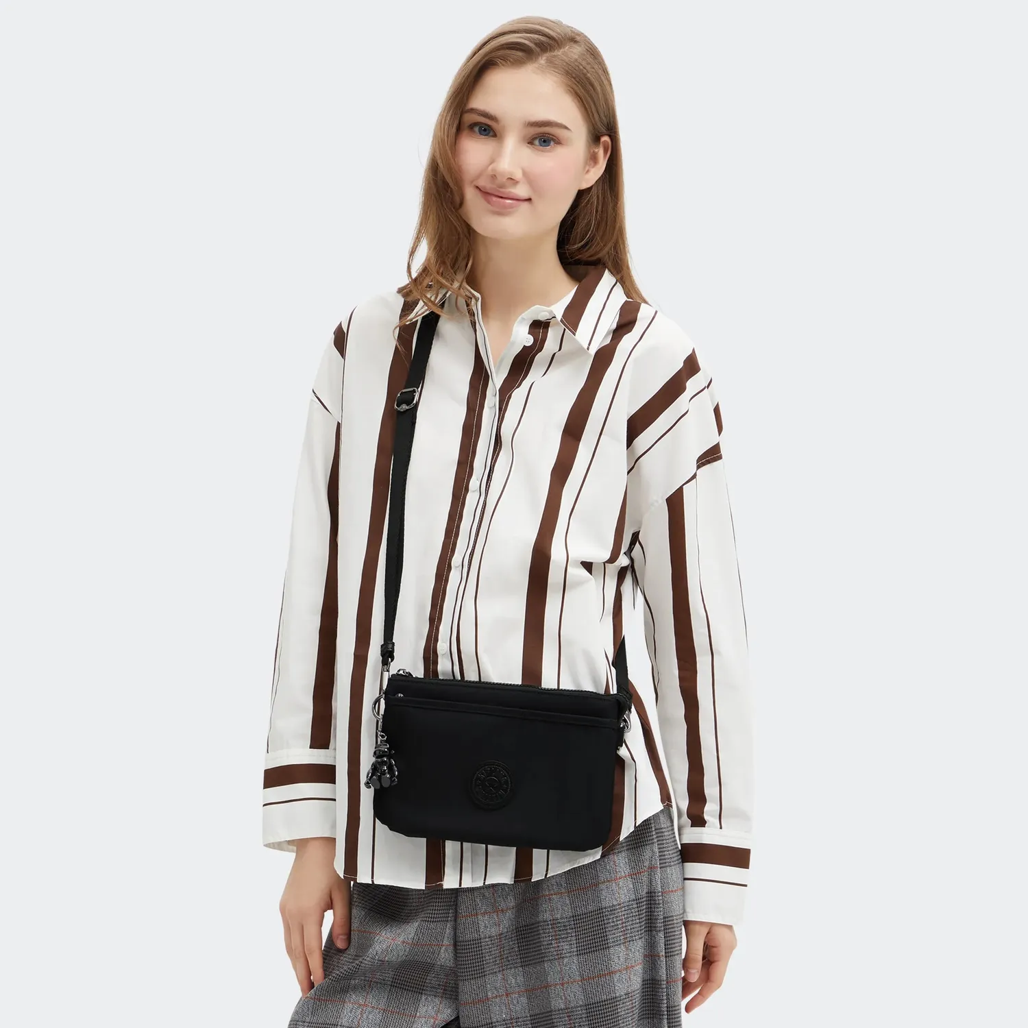Kipling Riri crossbodytas klein Infinite Black waterafstotend