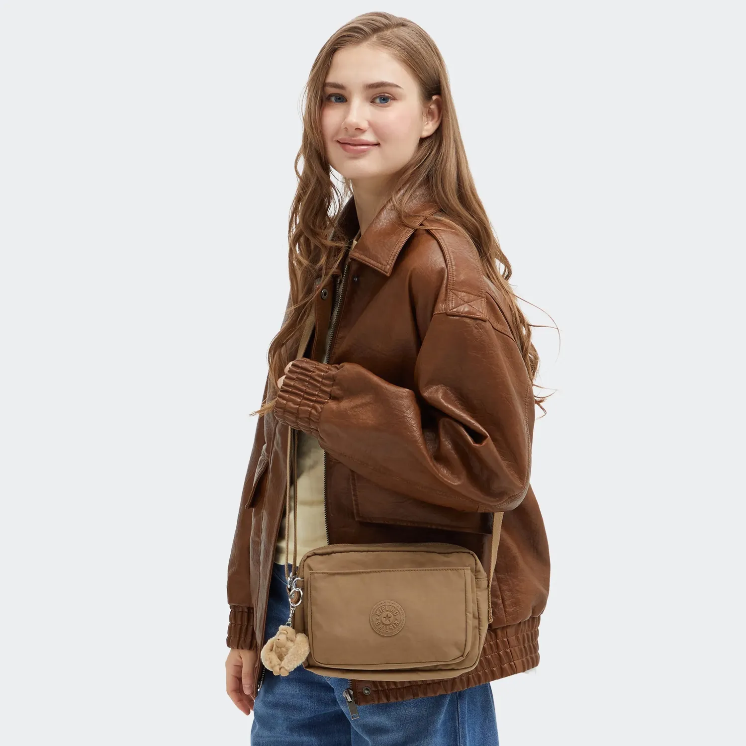 Kipling Abanu M crossbody Early Tan met 2 ritsvakken